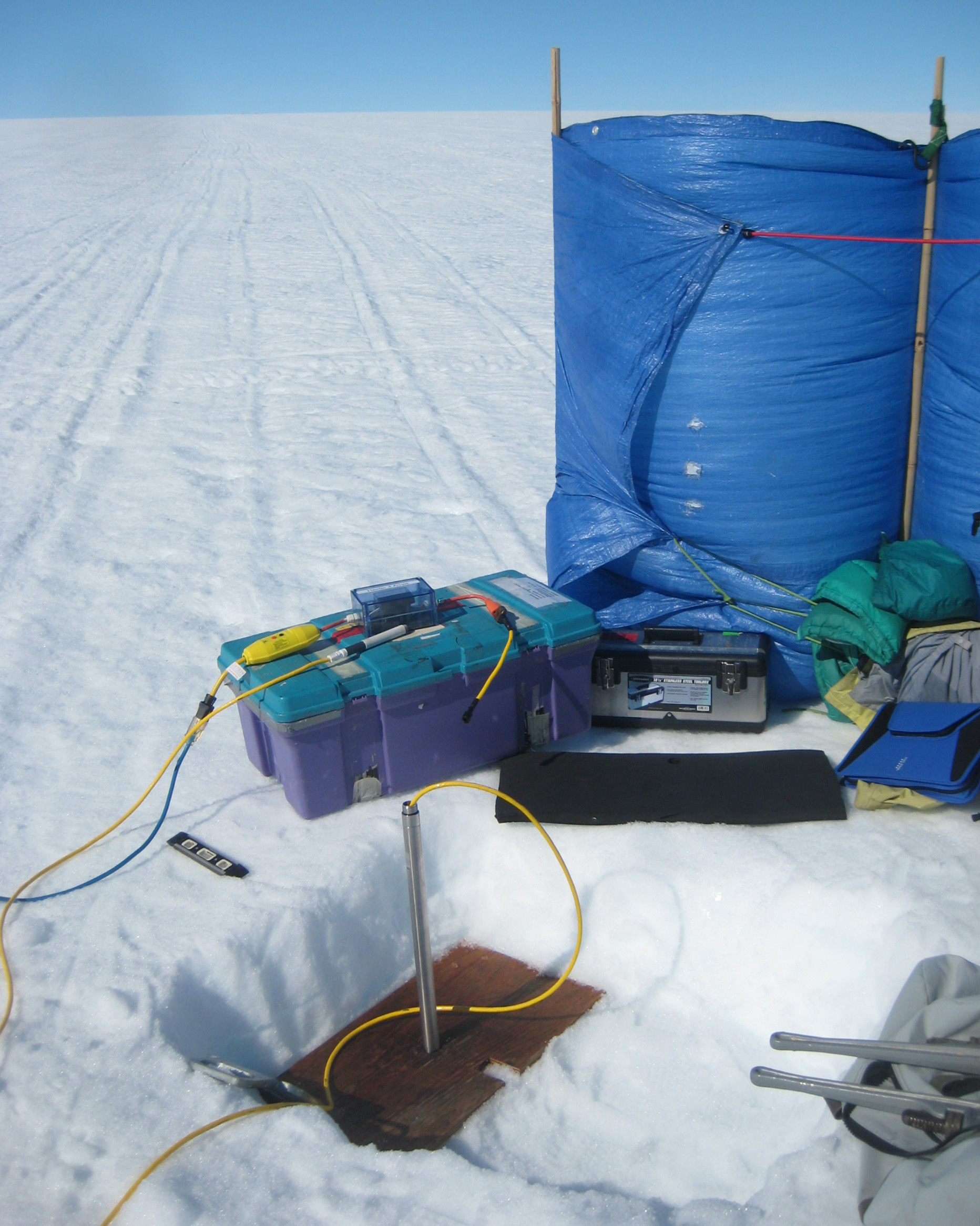 Installing one of two temporary wells for hydrology work.