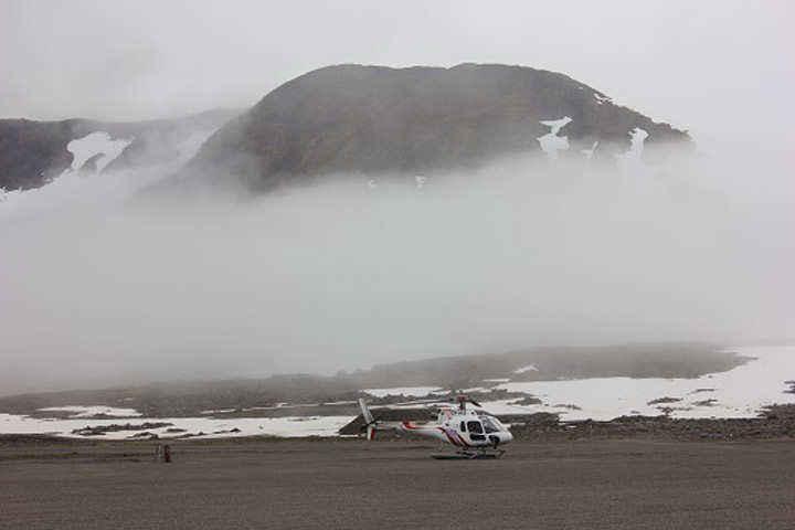 Fog rolled in over the airport with the helicopter we'll be using in the background.  