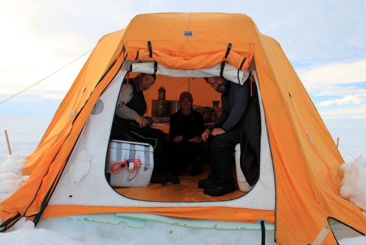 Anatoly, Lynn and Nick taking a picture break in the cook tent.