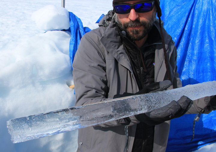 Nick showing a beautiful clear ice layer found below the firn aquifer.