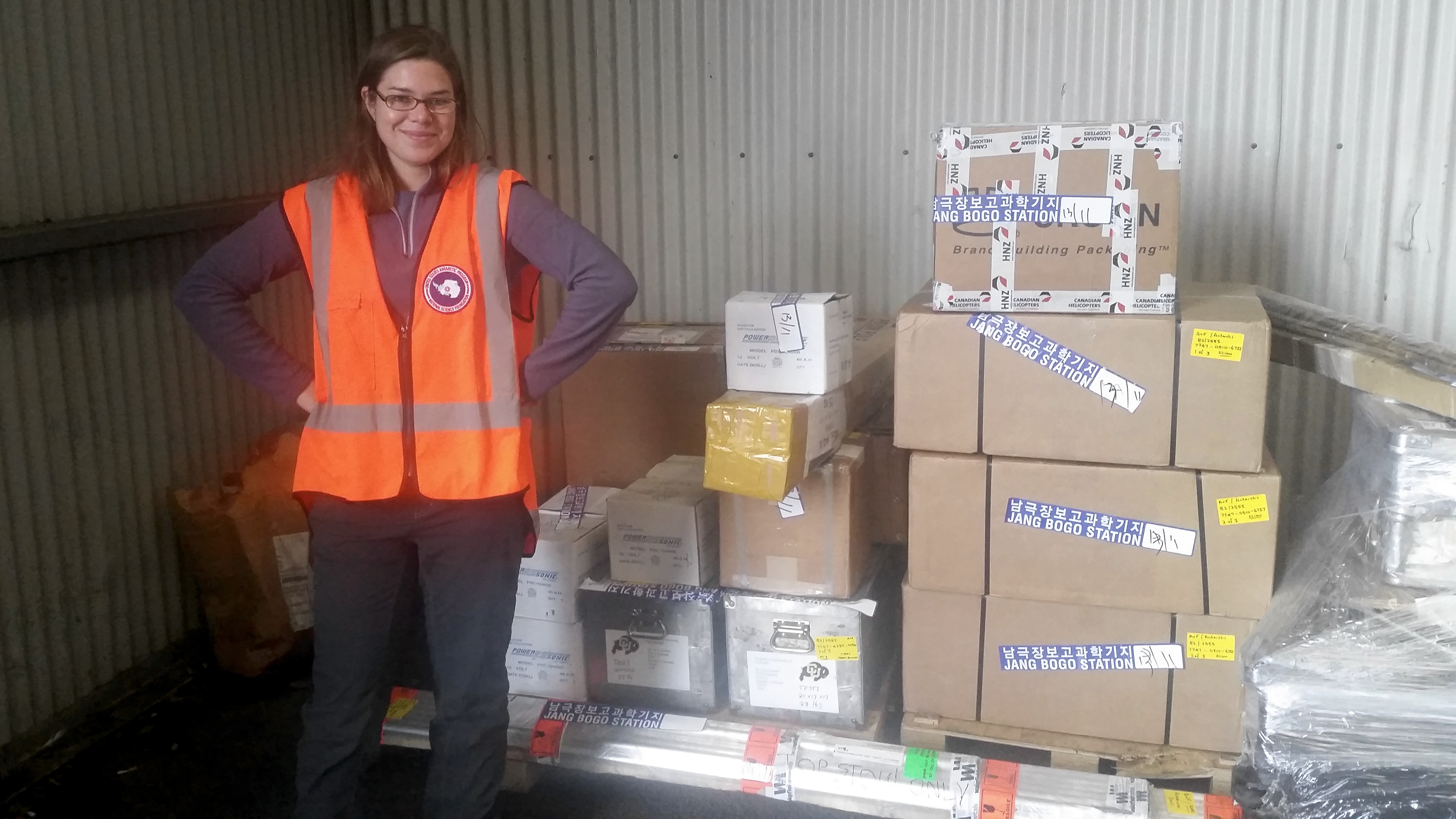 Christine stands near to our instruments and equipment, ready to be shipped to Antarctica.