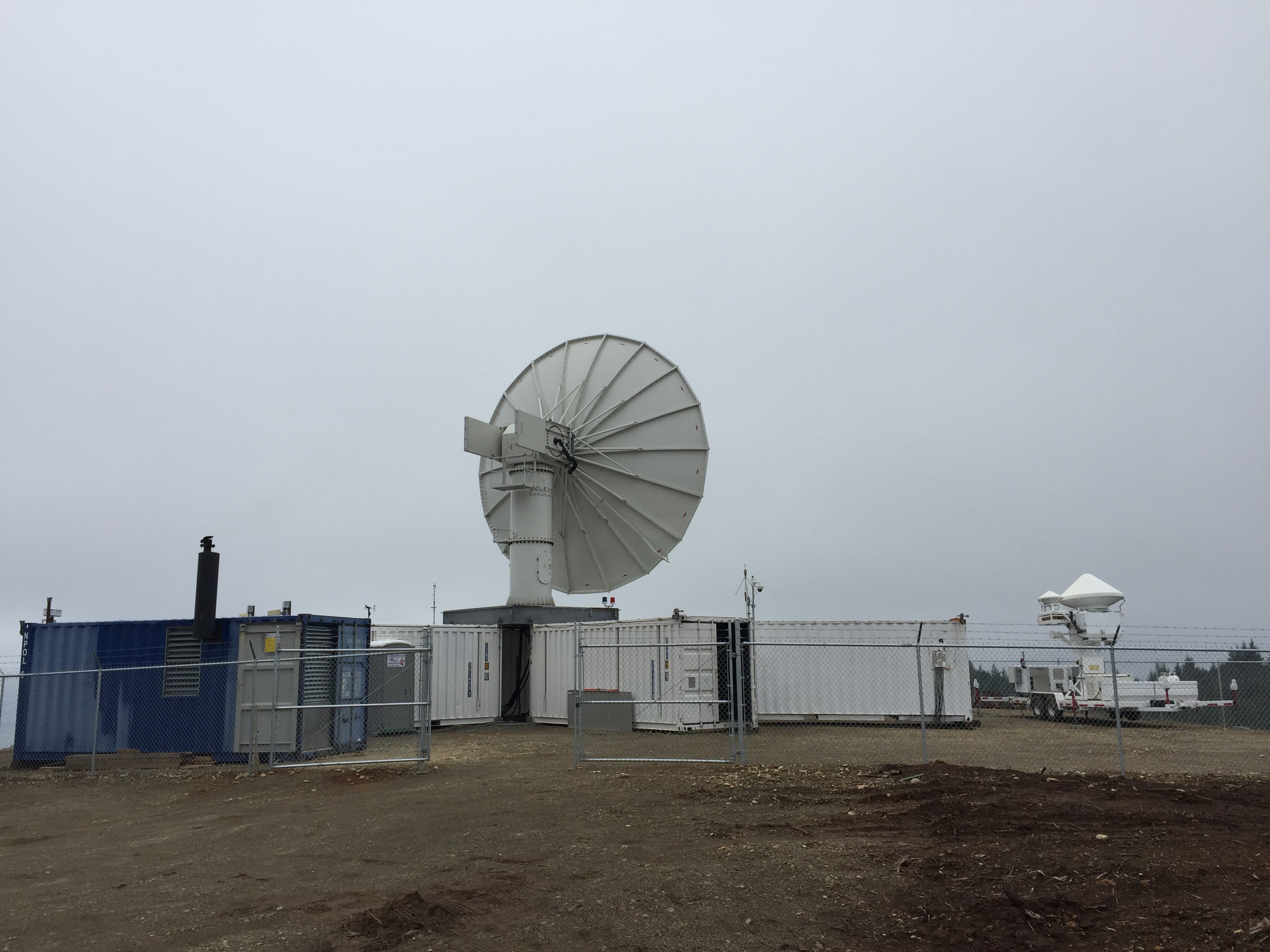 The S-band weather radar called NPOL and the Ku- Ka-band radar stand ready to sample storms. Photo by Dr. Angela Rowe