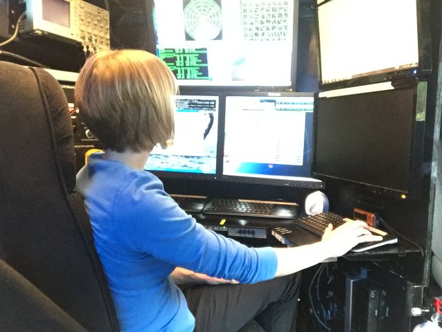 Dr. Angela Rowe monitoring data inside the DOW truck.