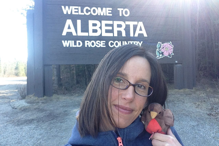 As Chirpy and I were posing in front of the Welcome to Alberta sign, some people in a car stopped and said they thought he was a real bird! Photo credit: Natalie Boelman.