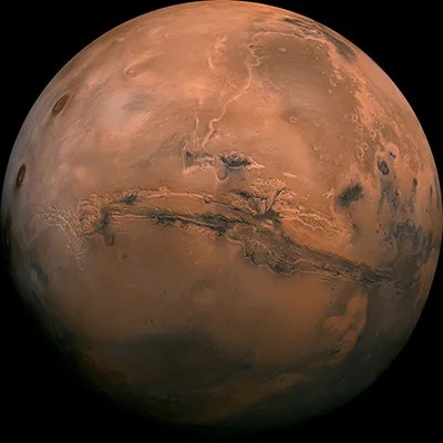 The bright red-orange surface of Mars as seen from space.