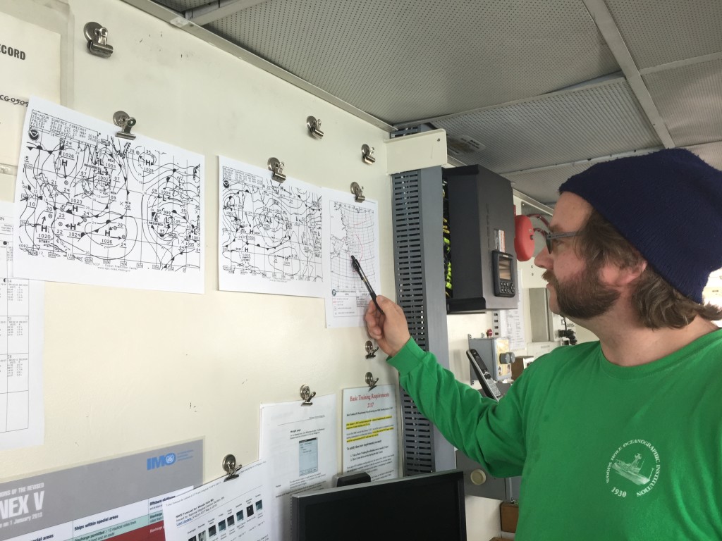 Logan Johnsen, Atlantis navigator and second mate, studies weather and ocean forecast products to plan the best course to the ship's North Atlantic study site. Credit: Stephanie Schollaert Uz/NASA