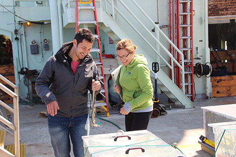 Making sure the light inside is right, Dr. Andreas Oikonomou and Françoise Morison installing a light sensor. Photo: Susanne Menden-Deuer