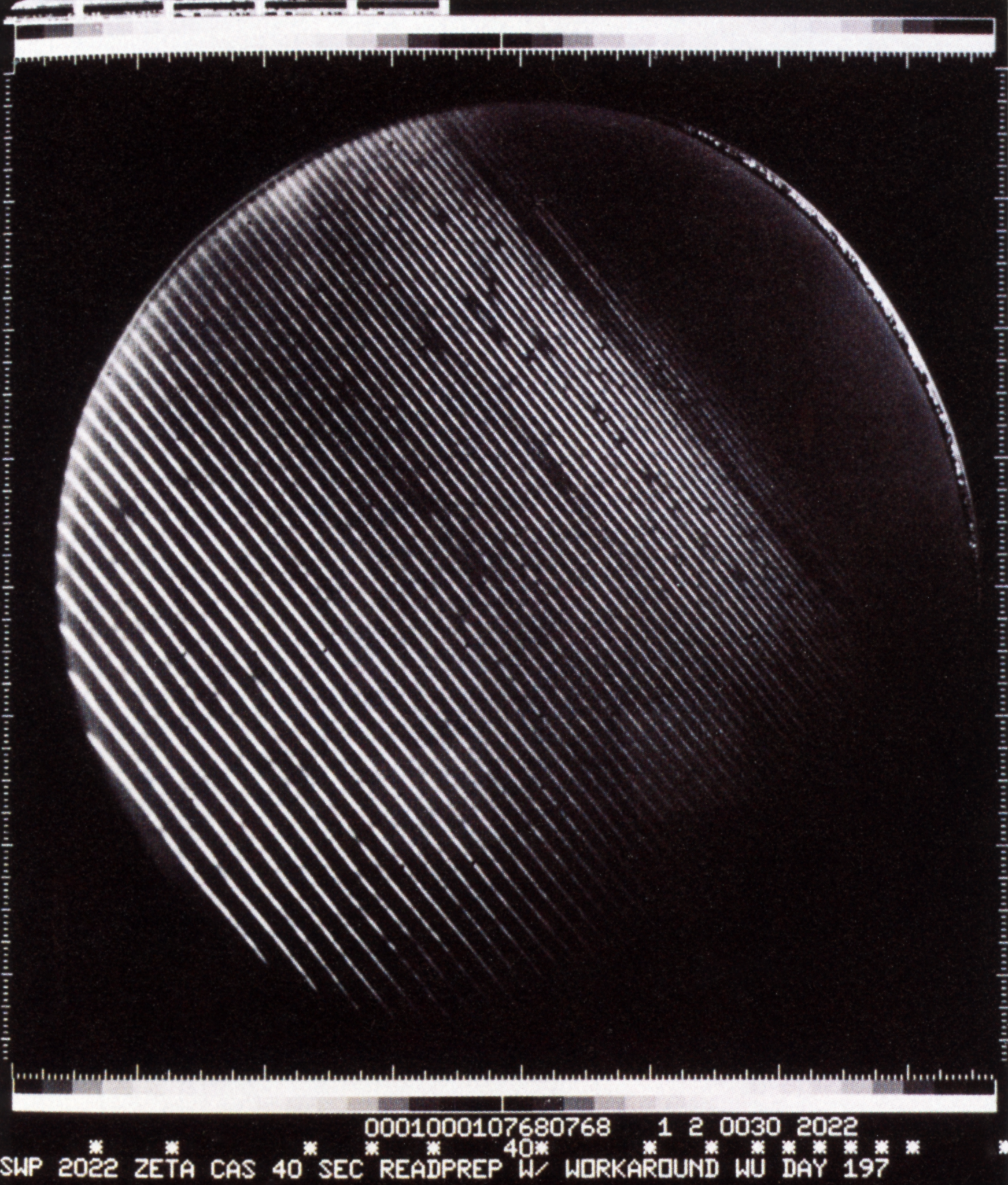 A striated black and while sphere appears against a black background.