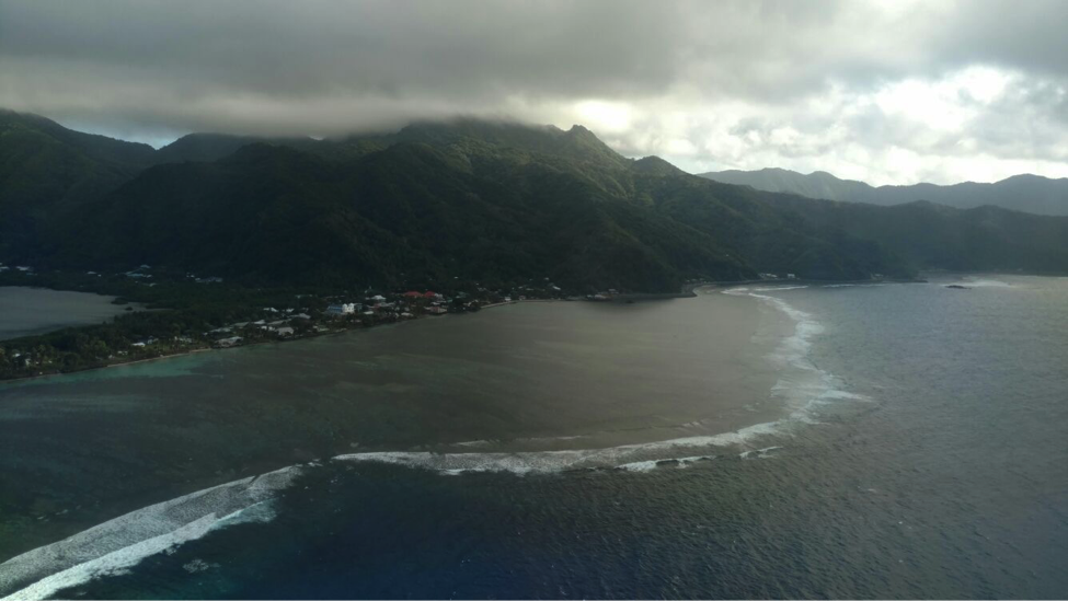 The DC-8 climbs steeply away from the tropical island of American Samoa, with its mountains covered by warm clouds. The next land we see on the ATom mission is the South Island of New Zealand, deep in winter. Credit: Bruce Daube, Harvard University.