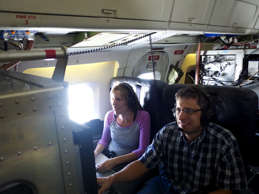 Agnieszka Kupc, NOAA/University of Vienna running our suite of instruments measuring aerosol microphysical properties and Dan Murphy, NOAA, running an instrument looking at the chemical composition of individual aerosol particles during the ATom equator flight. Credit: Christina Williamson