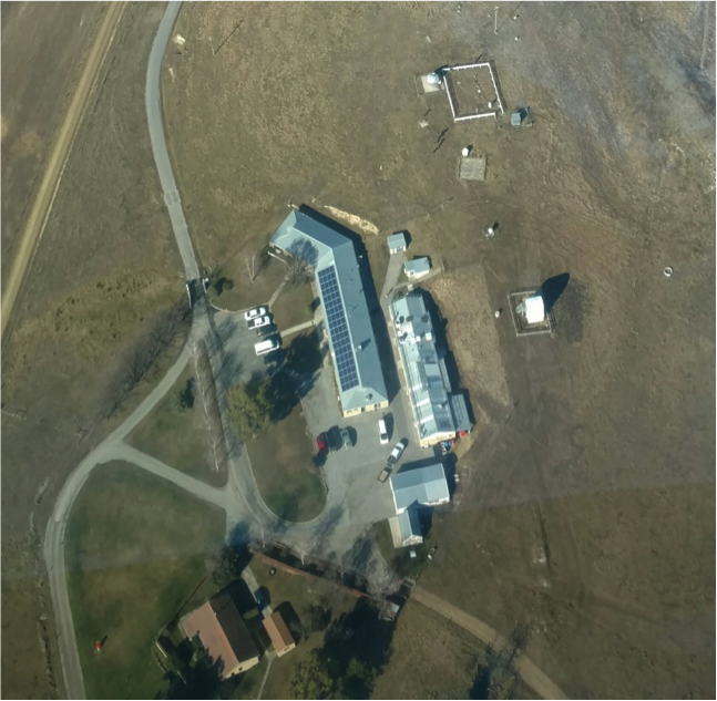 Lauder Station of New Zealand's National Institute of Water and Atmospheric Research (NIWA). The DC-8 made a low pass over this site in order to help calibrate the TCCON measurements of carbon dioxide, which are made by looking at the sun with a spectrometer housed in the domed structure at the top of the image. Credit: Bruce C. Daube, Harvard University, from the NASA DC-8