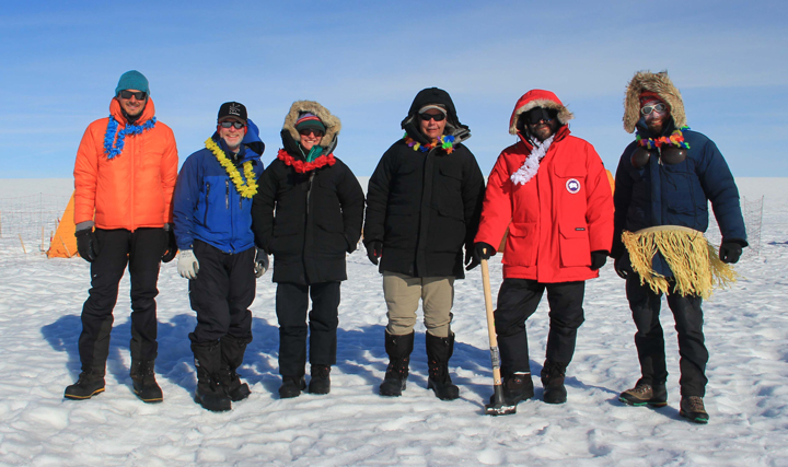 Left: Lynn and I posing at the front of the container after putting the snowmobile inside. Right: gear in the container, ready to over winter.