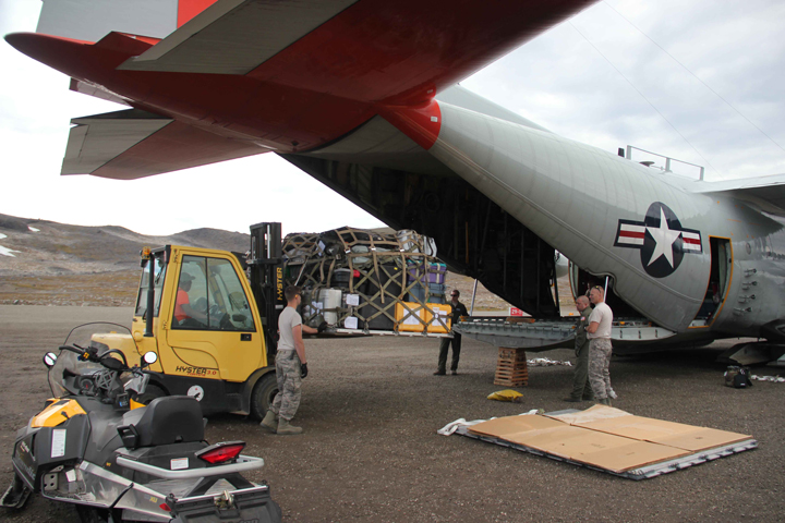 Loading up the science equipment into the plane.
