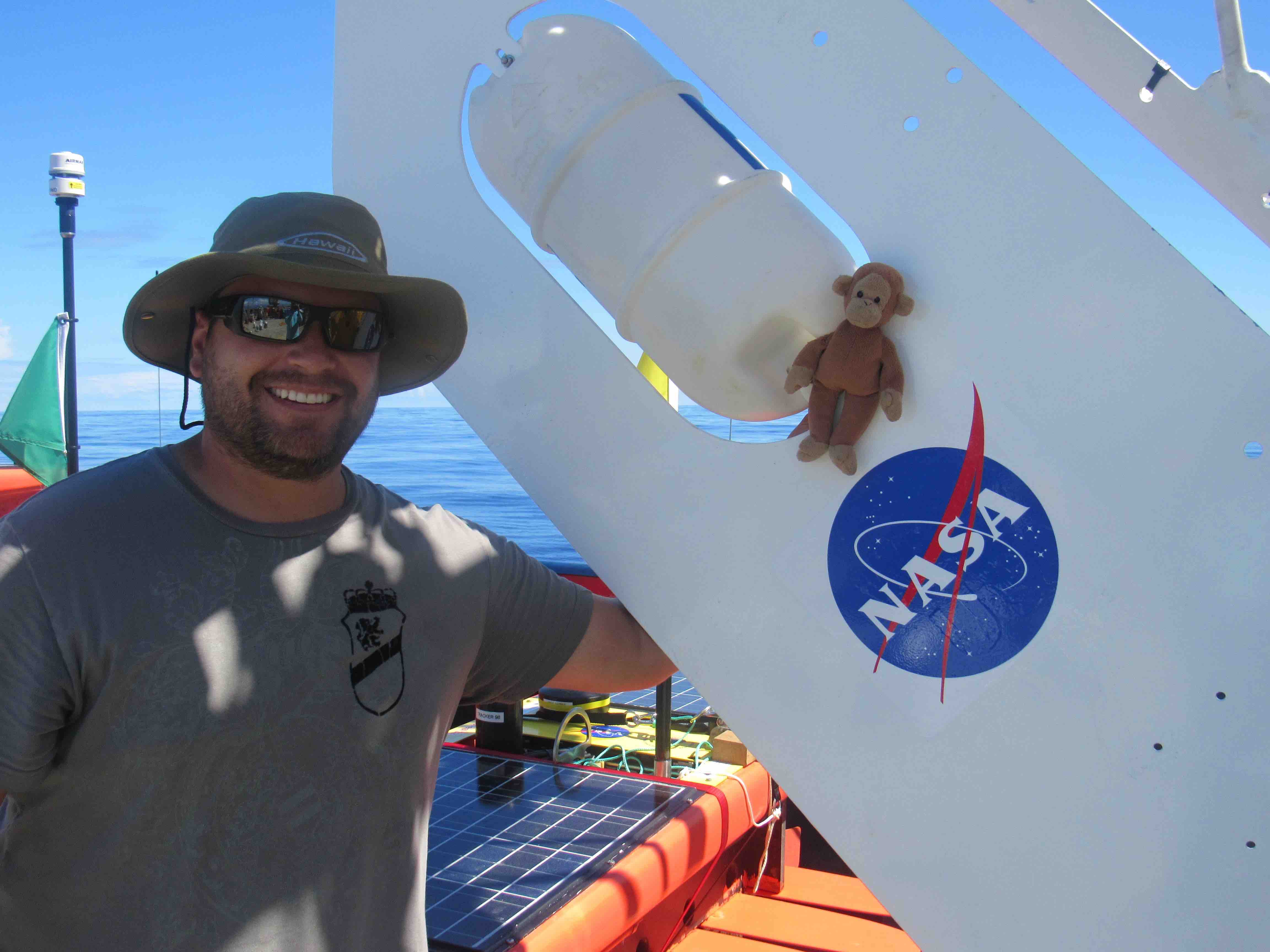 Andrew Meyer and Monkey pose with the SPURS-2 Central Mooring buoy.