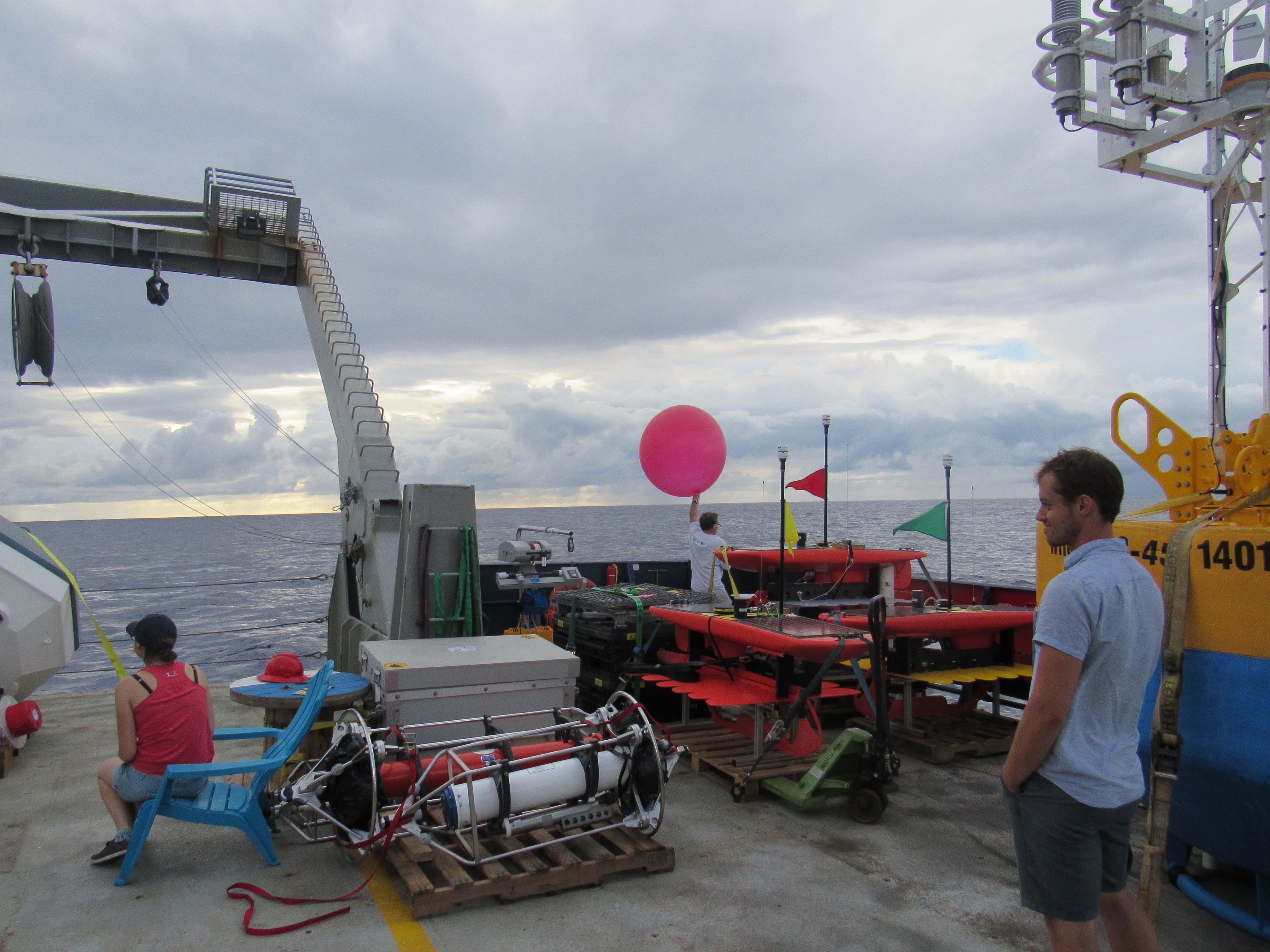 Launching a balloon from the R/V Revellle, for atmospheric sounding.