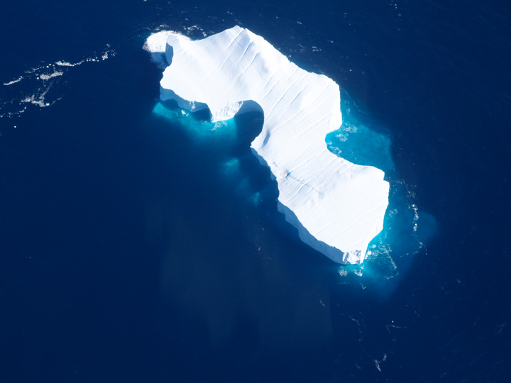 Fantastic view of a huge iceberg; the walls are likely 10-20 meters high. Also note the nice crevasses (the diagonal lines) on the surface.