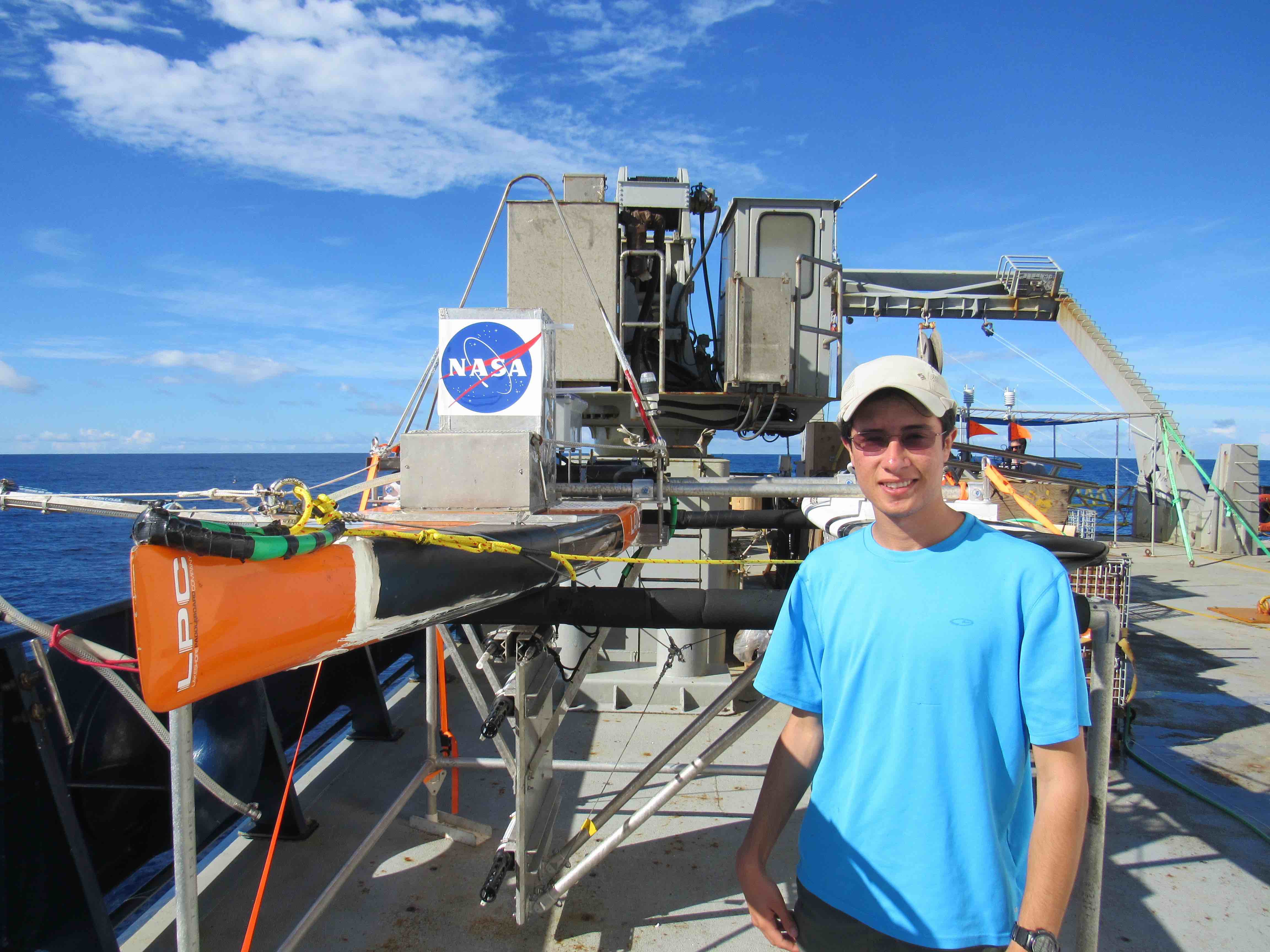 Suneil Iyer with Surface Slainity Profiler on deck (sensor to bottom left on keel)
