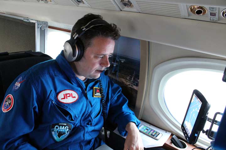 Lead scientist Josh Willis prepares to mark the probe drop on his GARMIN GPS.