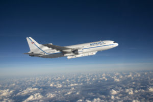 Photographed from the F-18 chase plane, the Orbital ATK L-1011 Stargazer aircraft is seen flying over the Atlantic Ocean offshore from Daytona Beach, Florida.