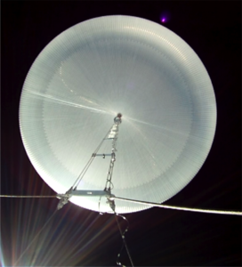 View from below of a fully inflated super pressure balloon floating at the edge of space.