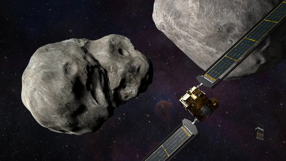 Illustration of NASA’s DART spacecraft and the Italian Space Agency’s (ASI) LICIACube prior to impact at the Didymos binary system.