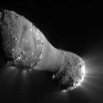 Closeup view of a peanut-shaped comet with sunlight reflecting off it