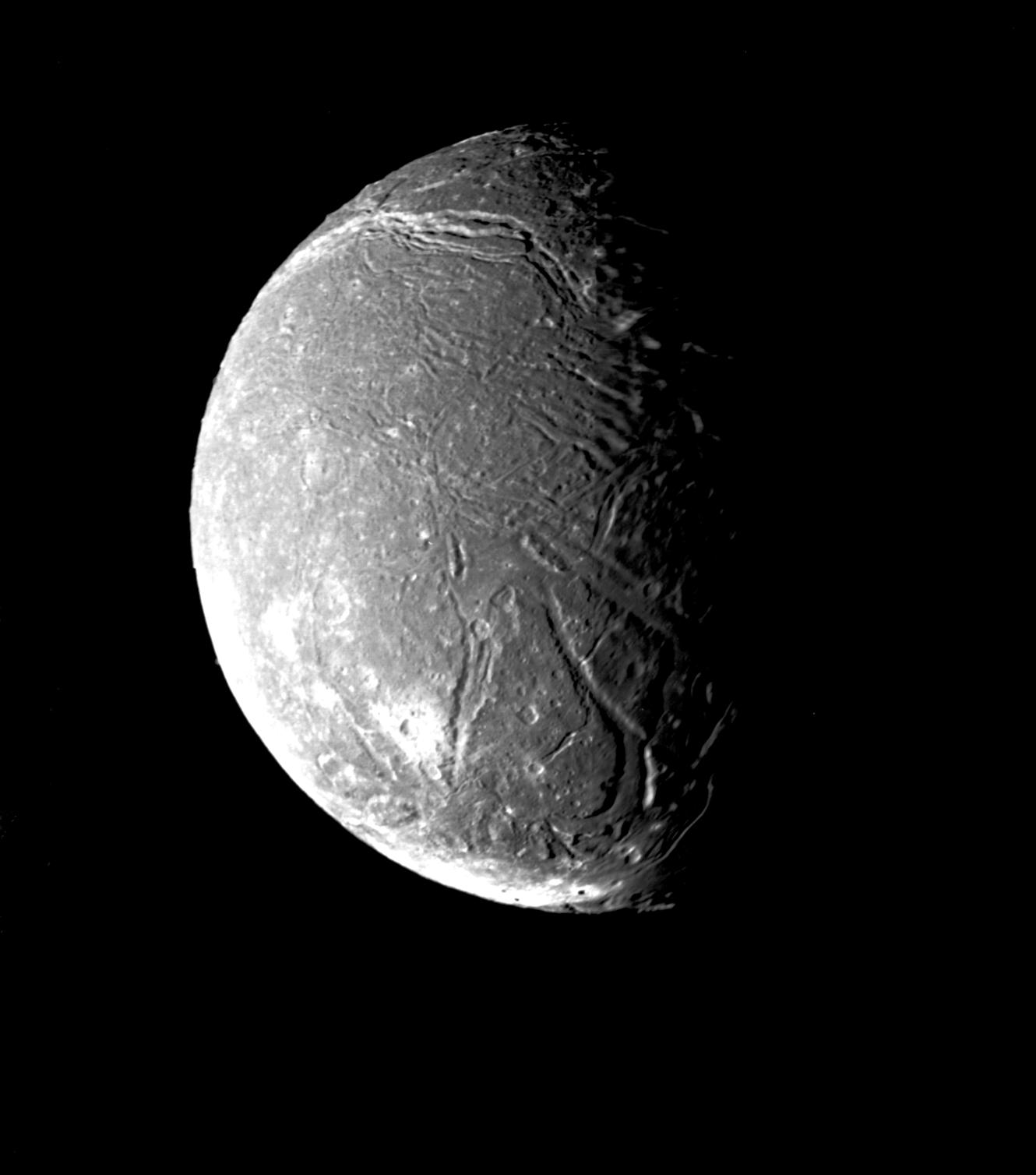 Ariel, a moon of Uranus, has numerous valleys and fault scarps crisscross the highly pitted terrain.
