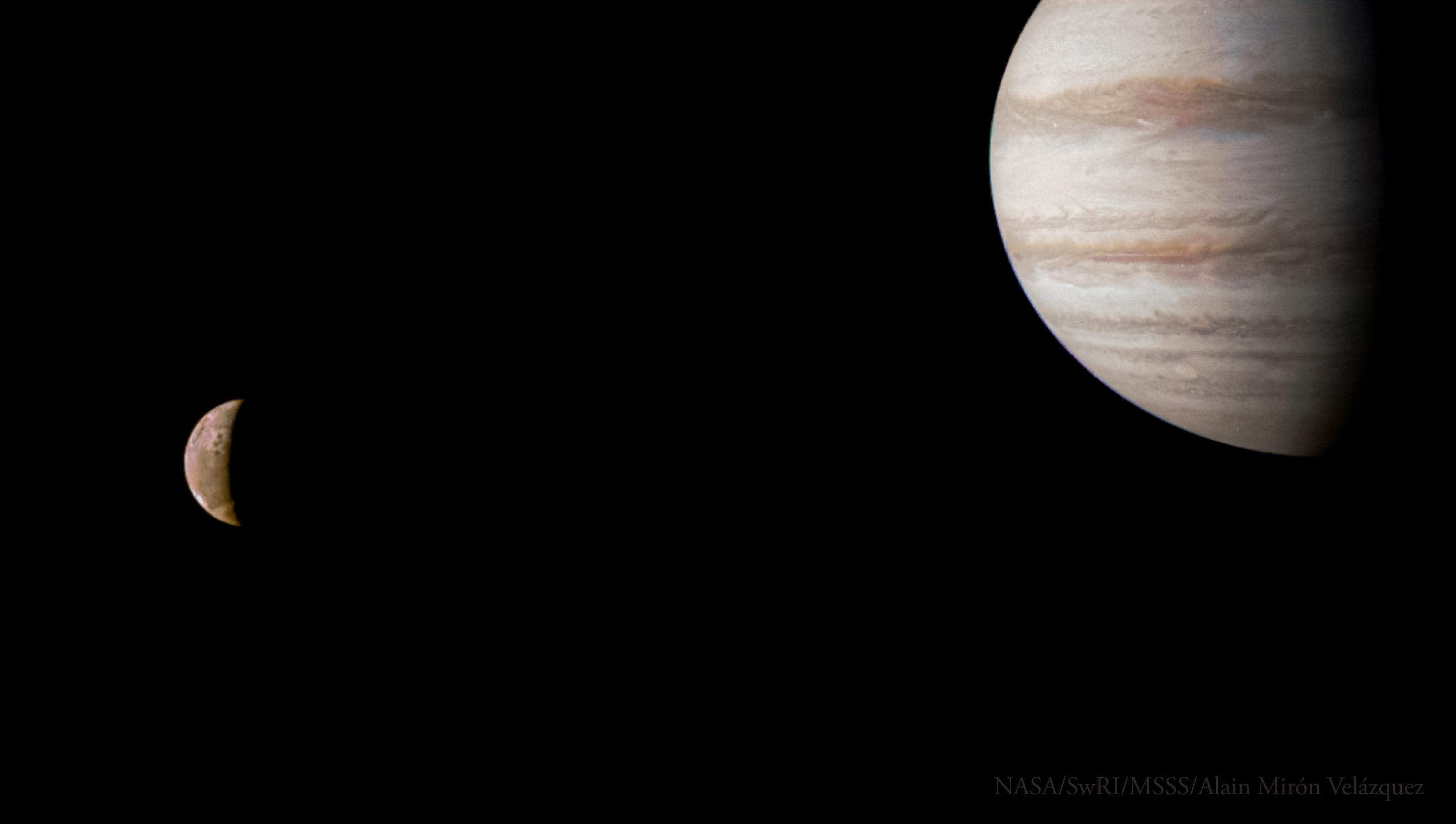 Jupiter is in the upper right corner with moon Io to the bottom left.