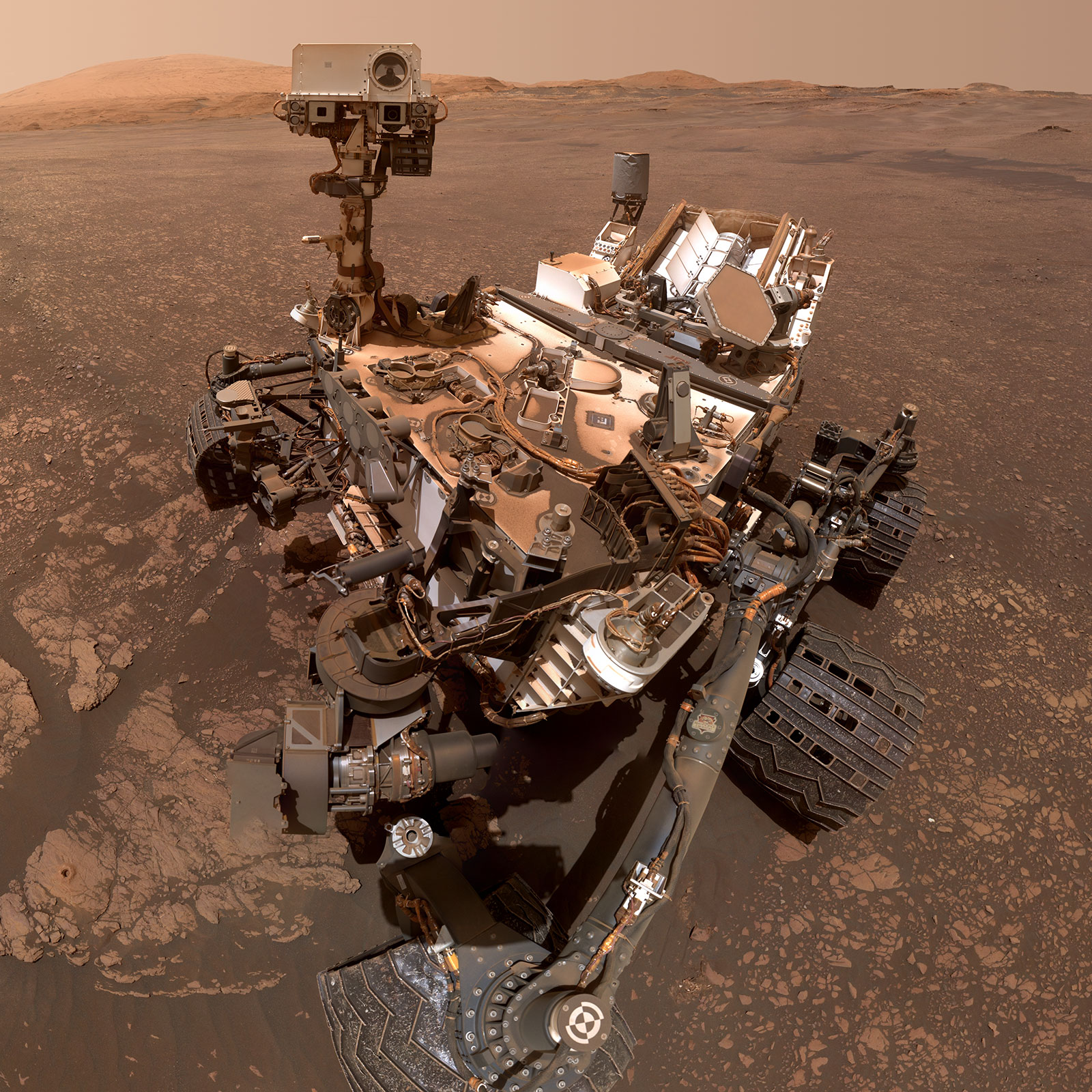 A mosaic of images shows the Curiosity rover covered in red dust and it explores the surface of Mars.