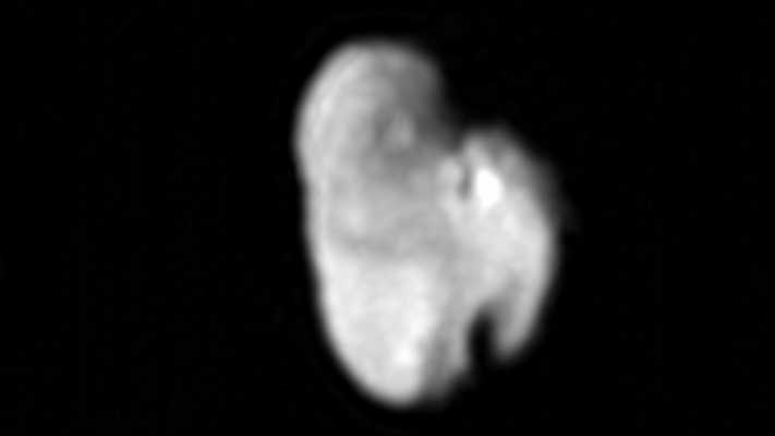 A light gray, irregularly shaped moon of Pluto
