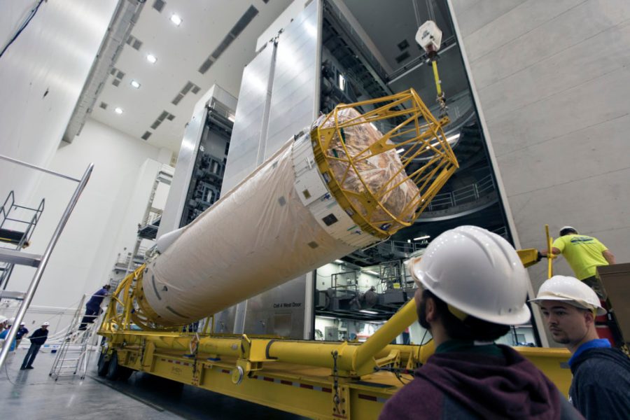 Under the watchful eyes of technicians and engineers, the Centaur upper stage that will help launch NOAA's Geostationary Operational Environmental Satellite-S, or GOES-S, is lifted from its transporter inside the Delta Operations Center at Cape Canaveral Air Force Station for further processing.