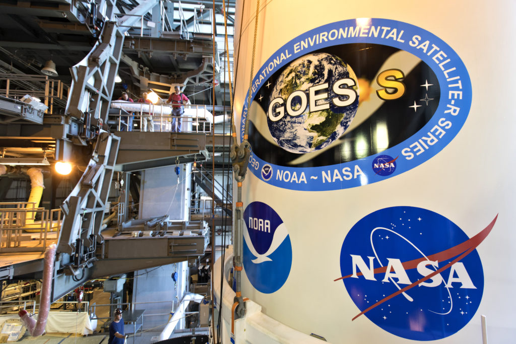 The payload fairing containing NOAA's Geostationary Operational Environmental Satellite-S (GOES-S) is mated to the ULA Atlas V rocket