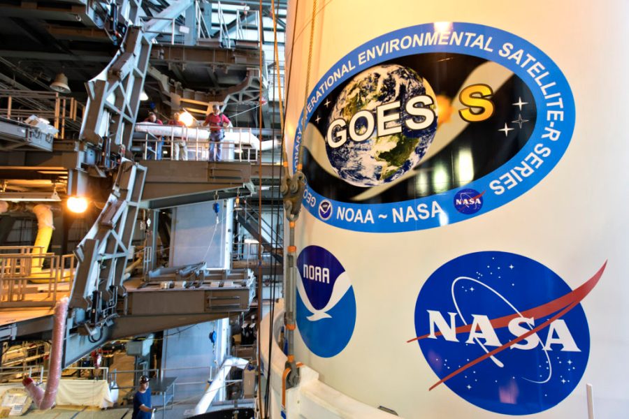 The payload fairing containing NOAA's Geostationary Operational Environmental Satellite-S (GOES-S) is mated to the ULA Atlas V rocket