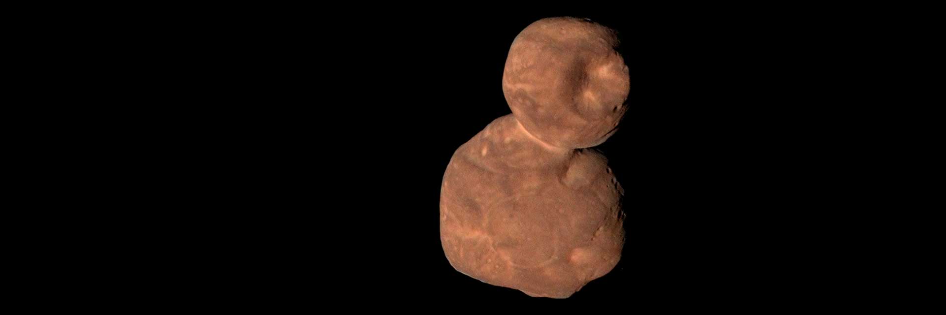 A rock that looks like a red space snowman