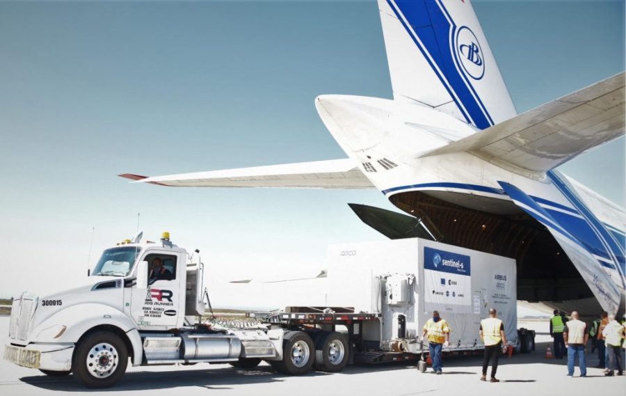 A shipping container containing the Sentinel-6 Michael Freilich satellite is transported on a truck to the SpaceX payload processing facility at Vandenberg Air Force Base after arriving in California on Sept. 24, 2020.