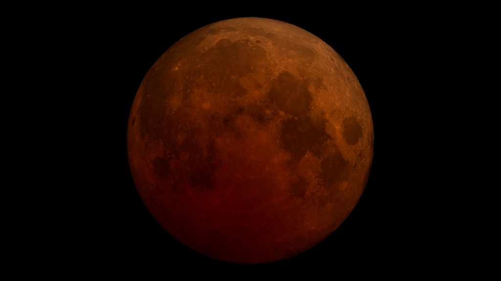 The Moon against a black background. The Moon is a dark red orange color, with dark gray splotches where the craters are.