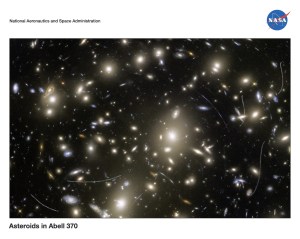 Curves and s-shaped lines seen on an image of a galaxy cluster.