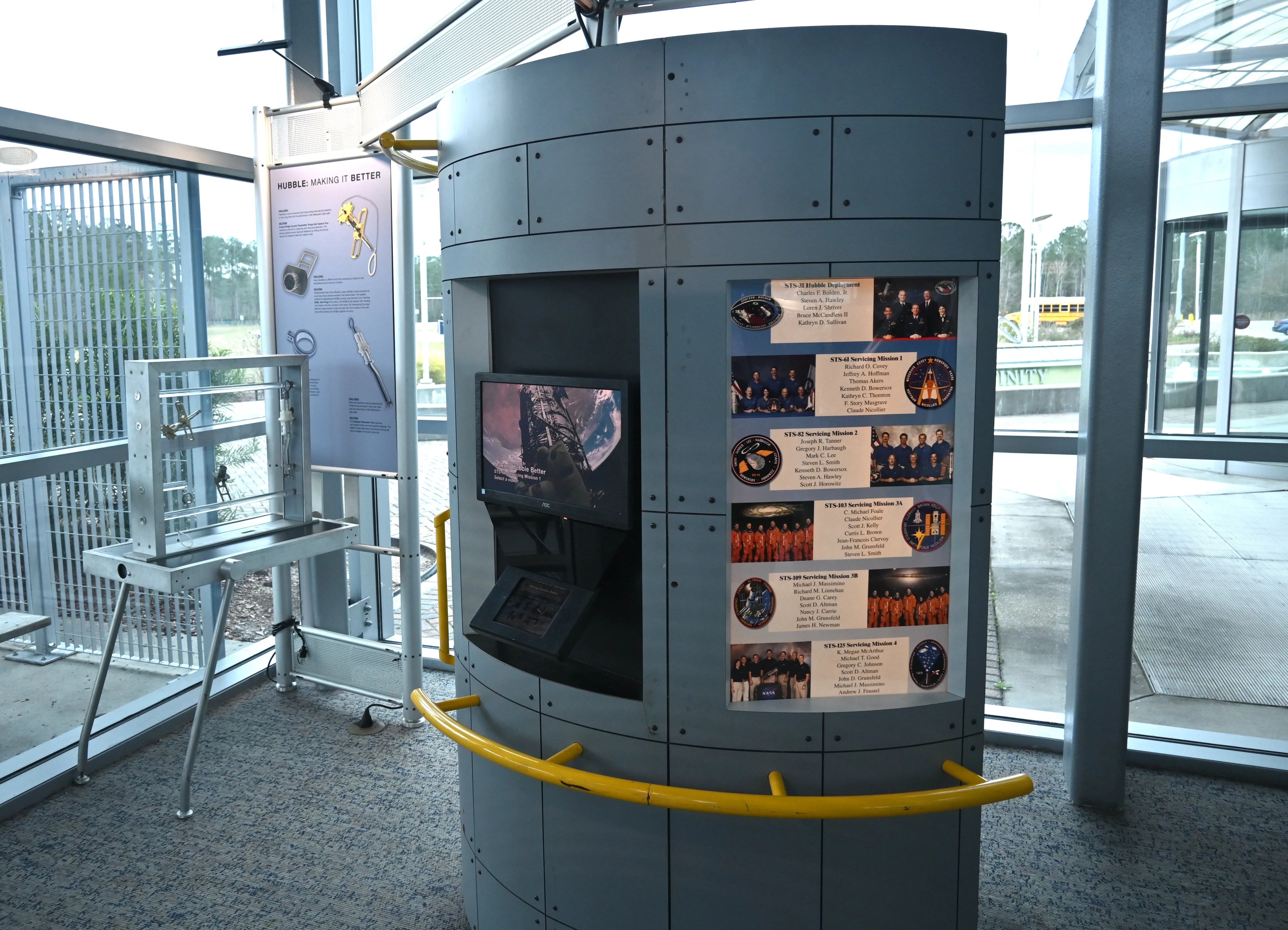 The HST servicing mission station highlighting each mission and the tools used by the astronauts