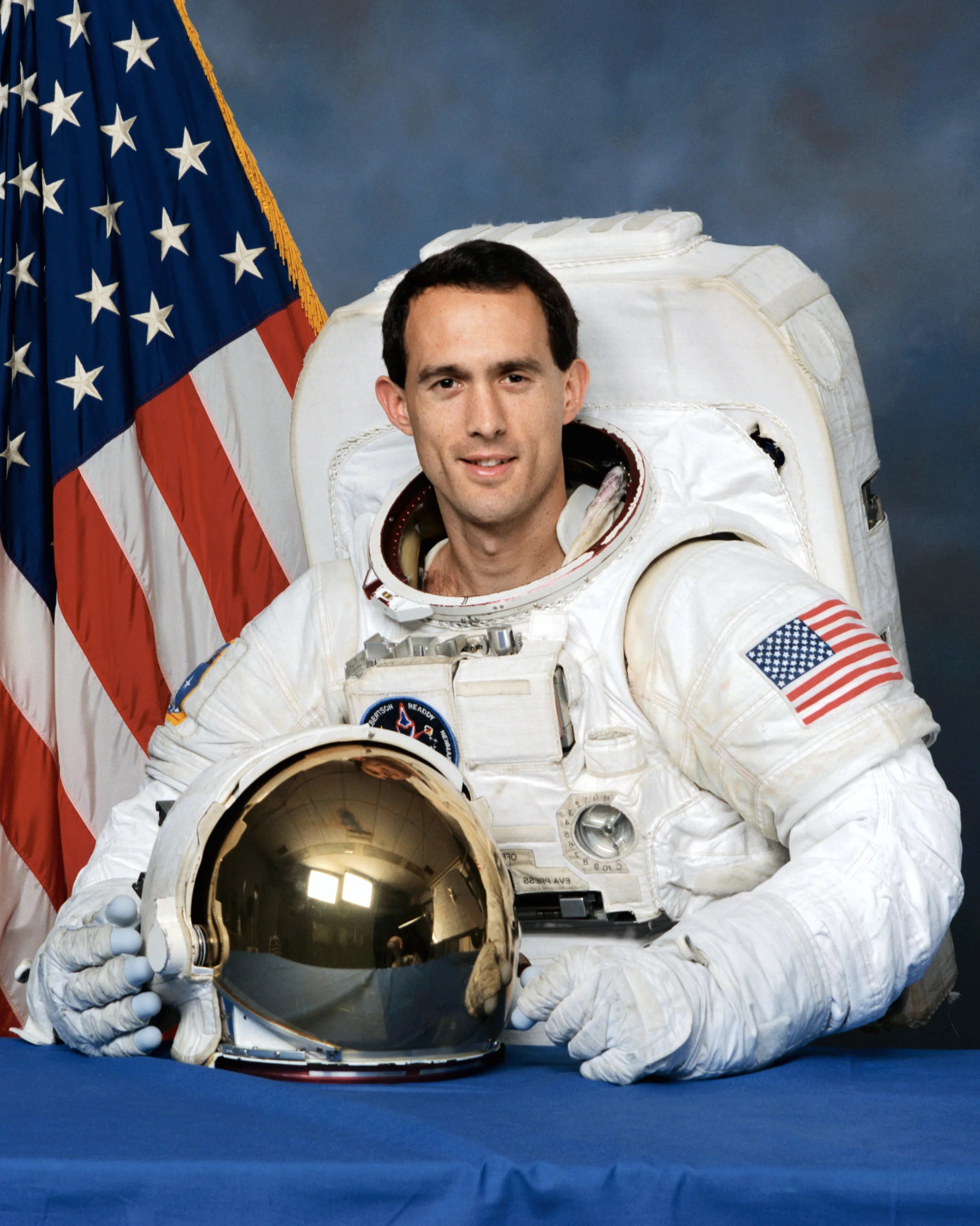 Official astronaut portrait of James Newman.