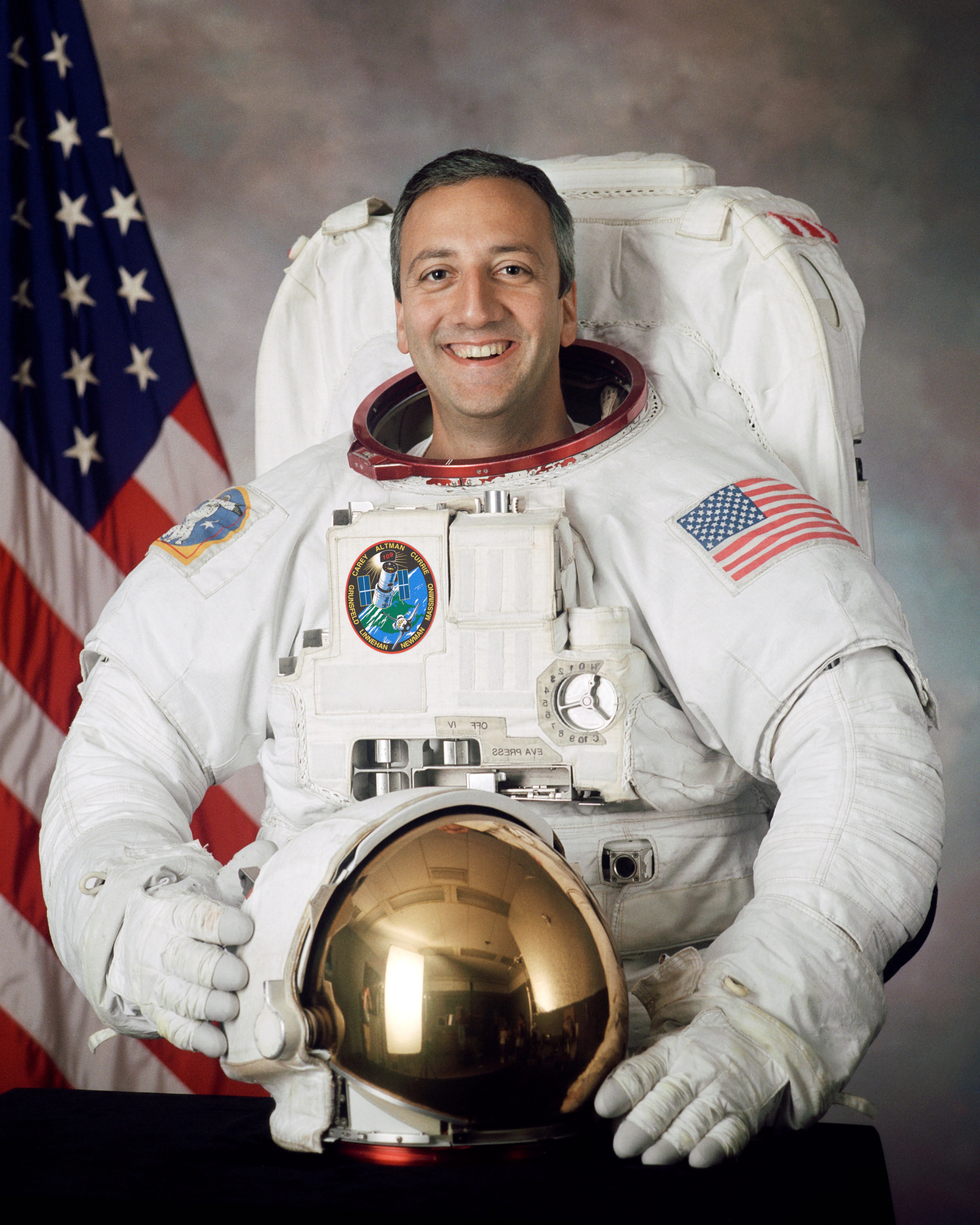 Official astronaut portrait of Michael Massimino.