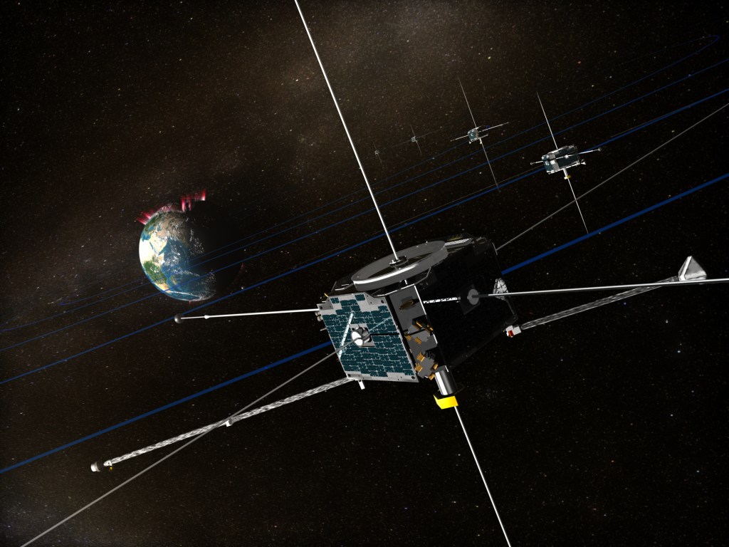 An illustration shows multiple boxy spacecraft orbiting Earth with glowing auroras at Earth’s north pole.