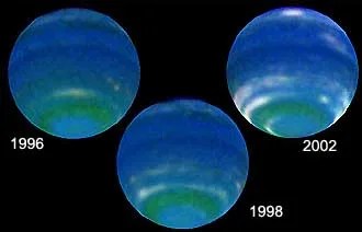 Hubble Space Telescope images of Neptune in 1996, 1998 and 2002. The change in brightness in the southern clouds show the arrival of the 40-year-long spring in that hemisphere.