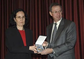 Administrator Griffin presents the Exceptional Scientific Achievement Medal to Neta Bachall, widow of astronomer and astrophysicist John Bahcall