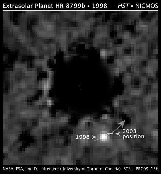 Hubble Space Telescope NICMOS (Near Infrared Camera and Multi-Object Spectrometer) coronagraphic image of a planet orbiting the star HR 8799