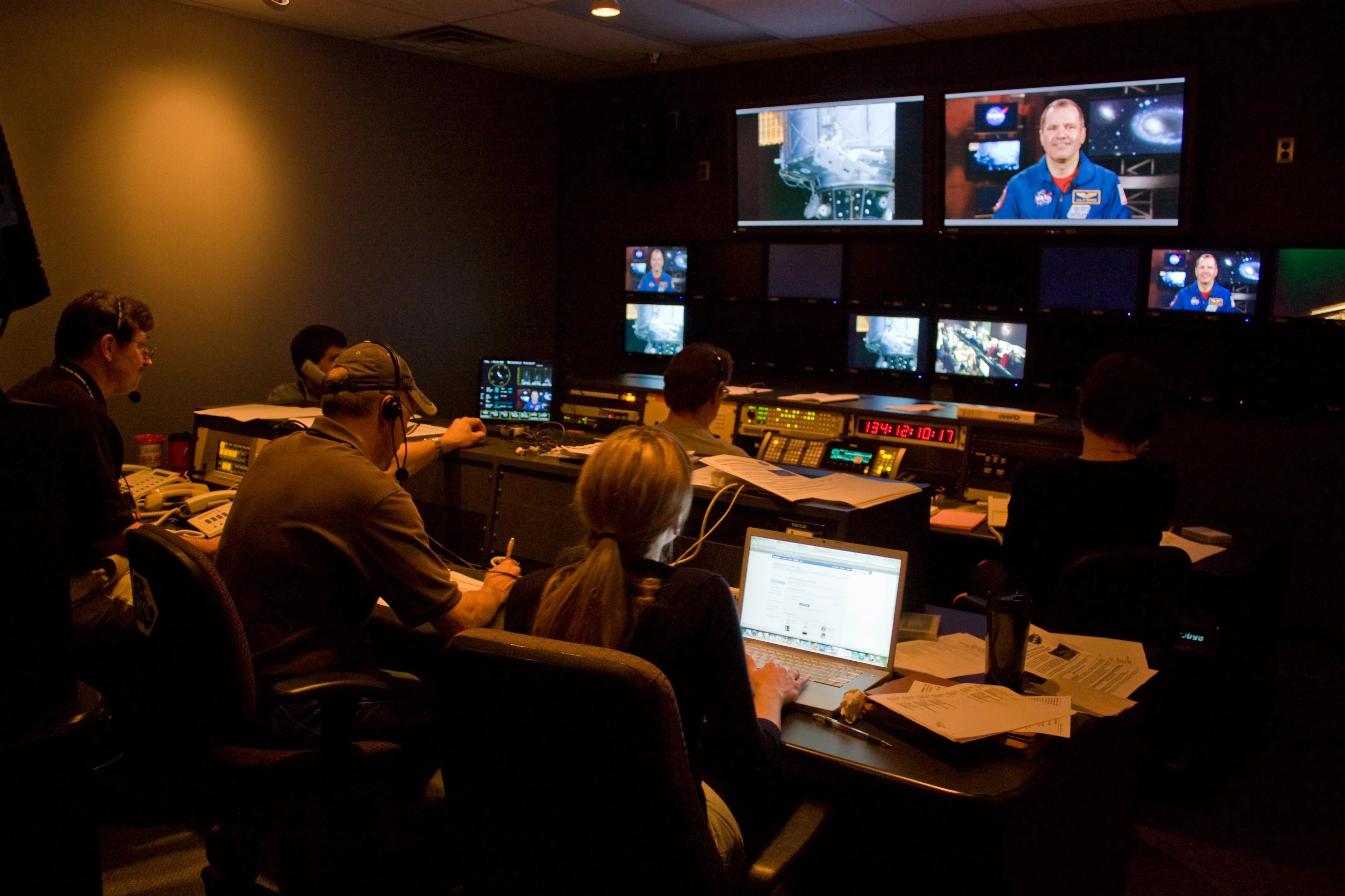 Producers in Goddard's TV studio control room