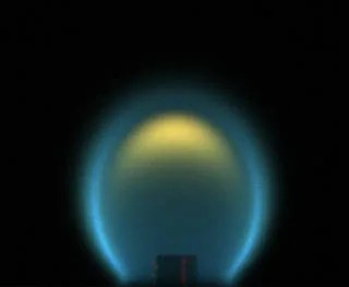 This is a photo of a flame under microgravity conditions. It is bulbous, compared to a long, tapered flame that would be found on Earth.