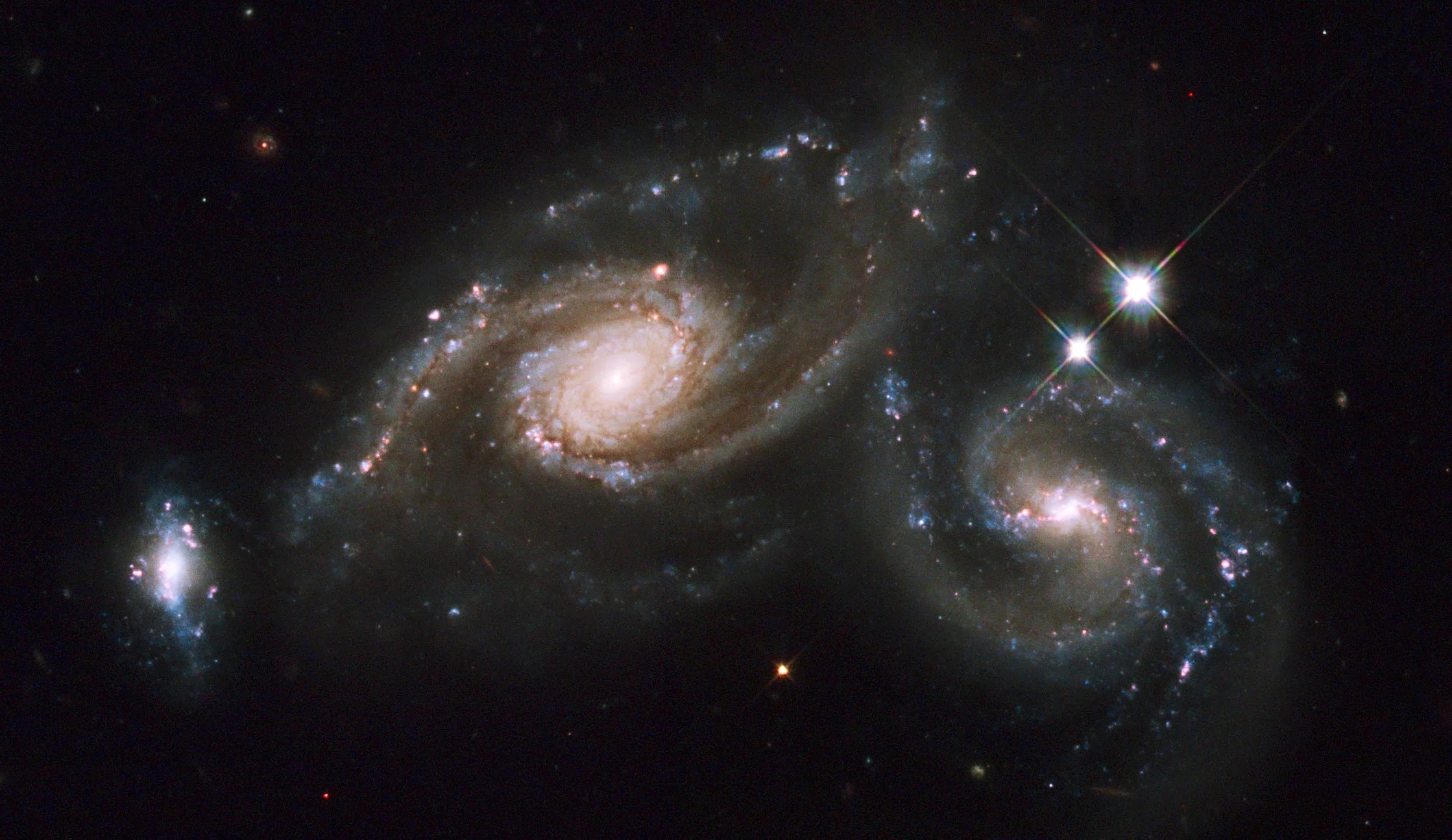The colliding galaxies of Arp 274 spans about 200,000 light years across and lies about 400 million light years away toward the constellation of Virgo.