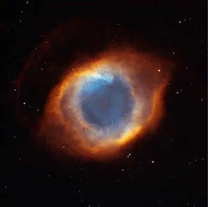 A glowing donut-shaped object called a planetary nebula.