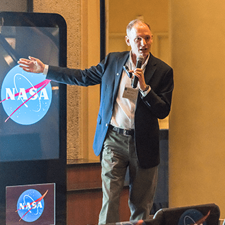 Photo of Barry Lefer presenting to audience