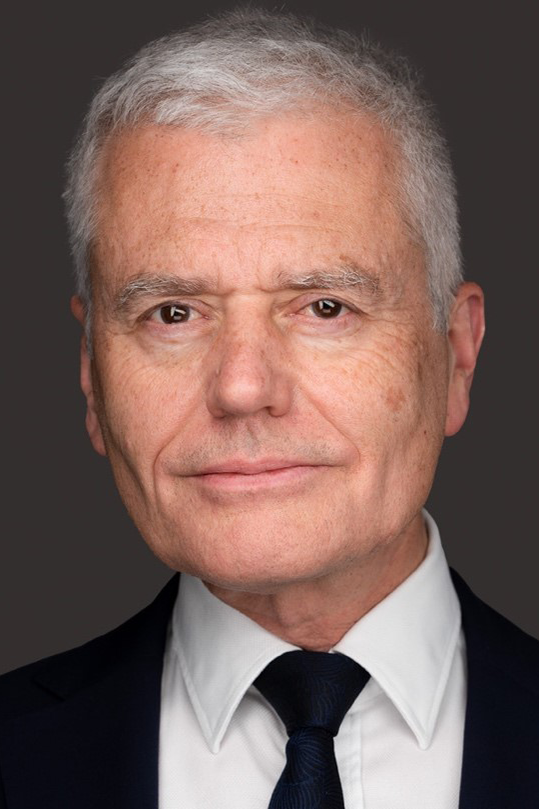 Portrait photo of Mark Clampin with a white shirt, black tie and suit jacket